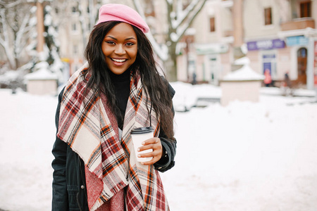 Elegant black girl in a winter city