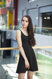 Make up beauty. Close up portrait young brunette woman in black 