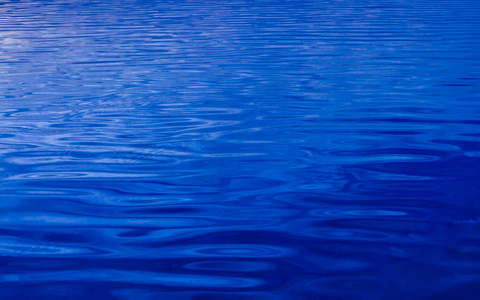 Water texture background. Classic blue color of the year 2020 la