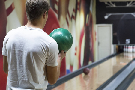 Man with bowling ball in club 