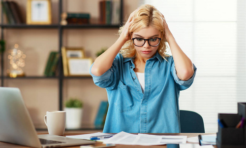 unhappy tired young   business woman in stress   at home  