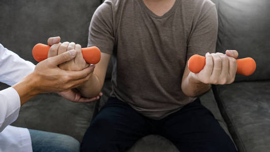 Physiotherapist working with patient doing with exercise, physic