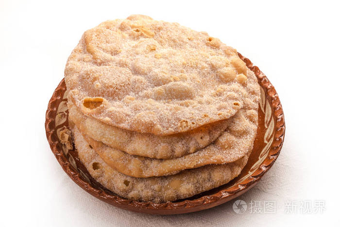 frittersbunuelosmadeofflourdoughthatisfried