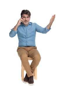 Positive casual man talking on his phone and gesturing 