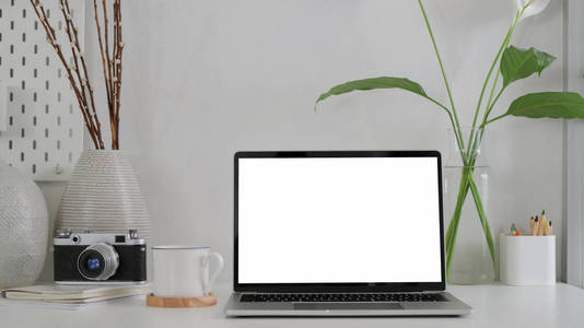 Close up view of trendy photographer with blank screen laptop, c