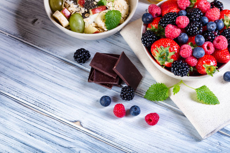 Bowl of fresh fruit. Bblackberries raspberries blueberries on 