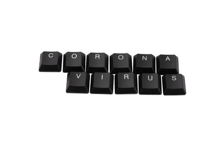 Word Coronavirus written on keyboard.  Isolated on white. 