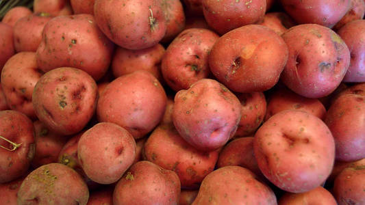 baked baby potatoes with spices in a frying pan on gray stone ta