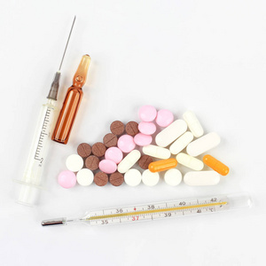 medicinal tablets, ampules for injections, thermometer, syringe 