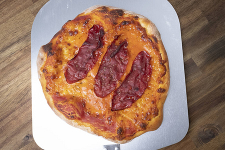 homemade pizza dough with tomato sauce and mozzarella on baking 