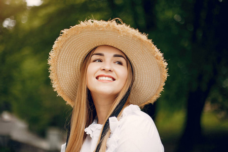 Elegant and stylish girl in a spring park