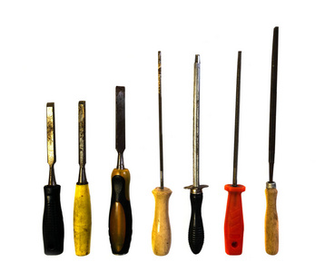 A set of different types of chisels and files. 