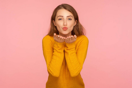 Portrait of gorgeous ginger girl in sweater sending sensual air 