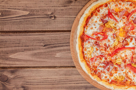 Pizza with Mozzarella cheese, salami, Tomatoes, pepper, Spices. 