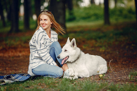 Elegant and stylish girl in a summer forest