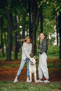 Elegant and stylish girls in a summer forest