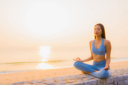 Portrait young asian woman do meditation around sea beach ocean 