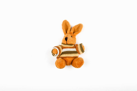 Brown plush hare on a white background. Old plush brown retro ha