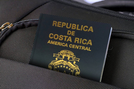 Close up of Costa Rica Passport in Black Suitcase Pocket 