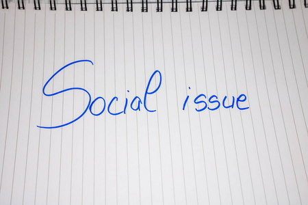 Social issue handwriting  text on paper, on  agenda. Copy 