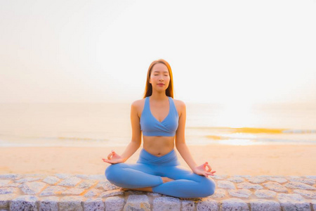 Portrait young asian woman do meditation around sea beach ocean 