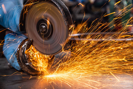 Welder working at the factory 