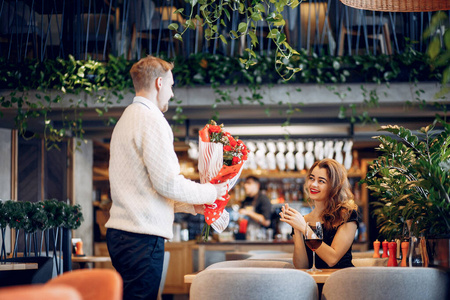 Elegant couple spend time in a restaurant