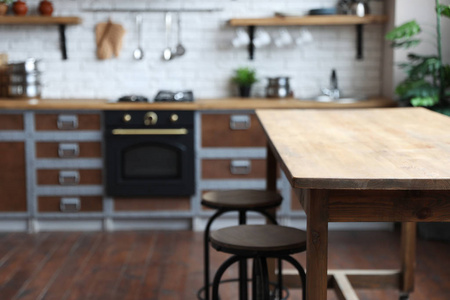 Empty wooden table in beautiful kitchen. Interior design