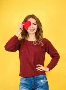 beautiful woman holding red heart 