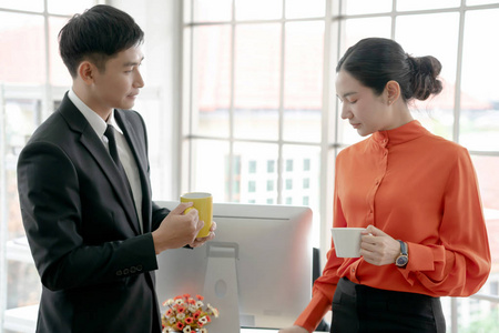 Businesswoman talking to colleague in  