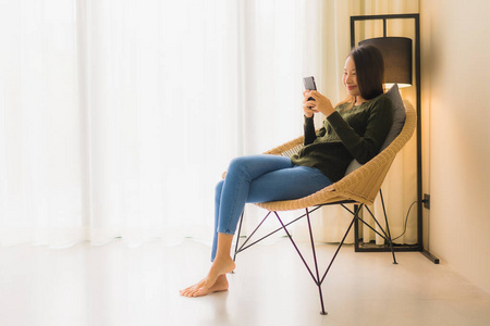 Portrait beautiful young asian women using talking mobile phone 