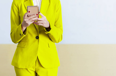 Businesswoman standing while using a mobile phone 