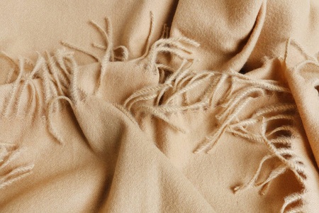 A soft beige blanket background. 