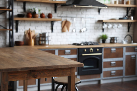 Empty wooden table in beautiful kitchen. Interior design