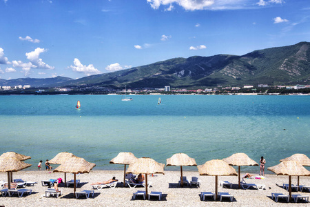 Umbrellas from the sun on the pebble beach of Gelendzhik in the 