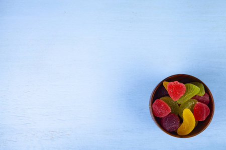 Multicolored marmalade in a bowl 