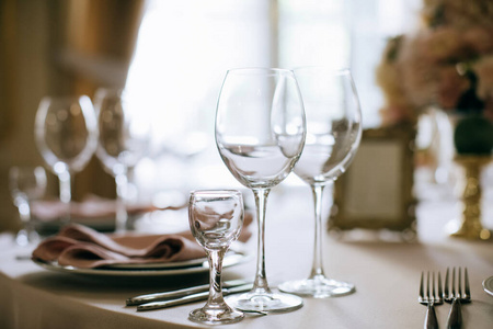 Elegant table setting, glasses on table in restaurant