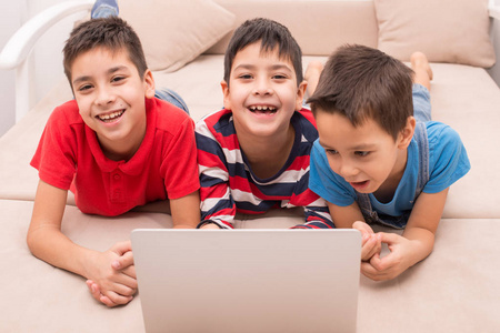 Children of different ages use gadgets for games, communication 