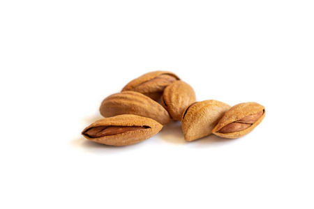 almonds nuts in their skins and peeled isolated on white backgro