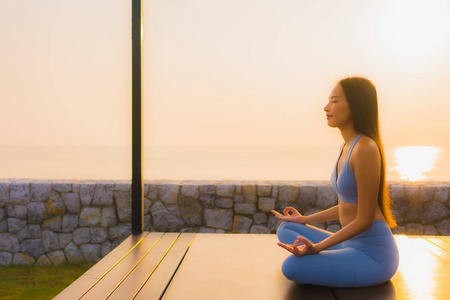 Portrait young asian woman do meditation around sea beach ocean 