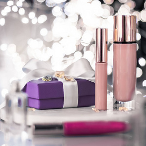 Holiday makeup foundation base, concealer and purple gift box, 