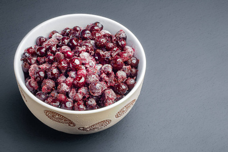 Frozen currants. Frozen berries in a bowl. Organic food. Saving 