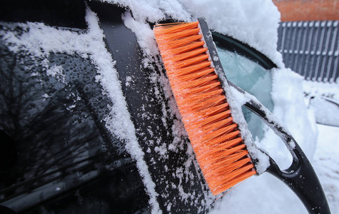  Brush the snow from the car