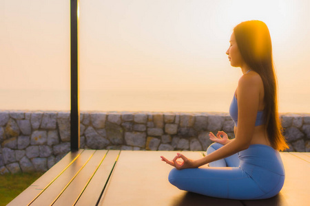 Portrait young asian woman do meditation around sea beach ocean 