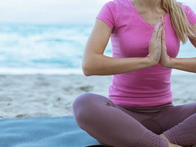  Caucasian Young Woman Doing Yoga at the Beach, Ocean on a backg