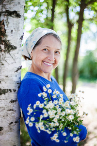  Beautiful elderly woman in   white scarf