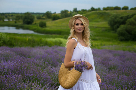 horizontal photo of a pretty blonde on a background of lavender 