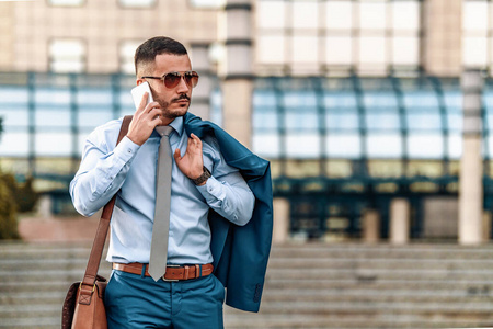 Portrait of young businessman outdoors 