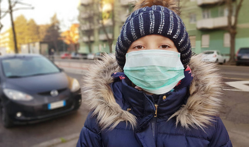 young girl in protective sterile medical mask  