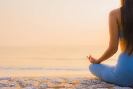 Portrait young asian woman do meditation around sea beach ocean 